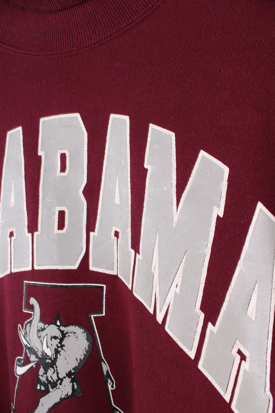 Alabama University Sports Sweatshirt in a maroon colourway, turtle neck, and has spell out logo printed on the front.