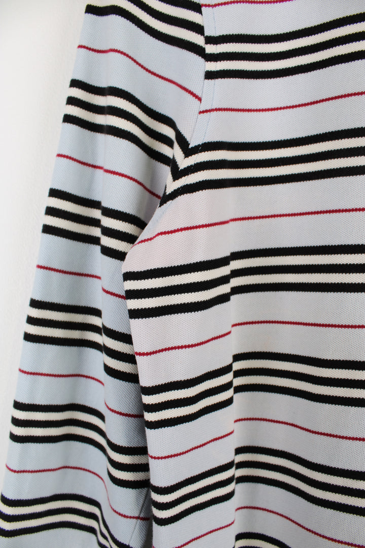 Vintage Burberry women's striped polo shirt features embroidered logo on the chest and 3/4 length sleeves