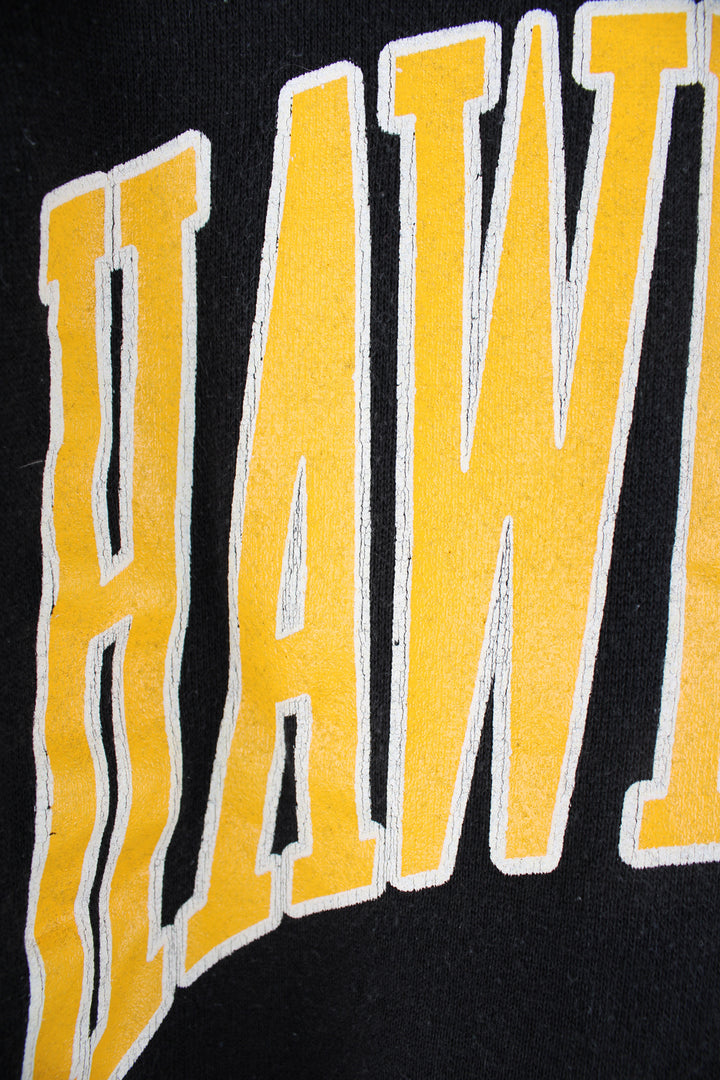 Vintage 90's made in the USA University of Iowa Hawkeyes black crewneck sweatshirt, features printed yellow spell-out details on the front 