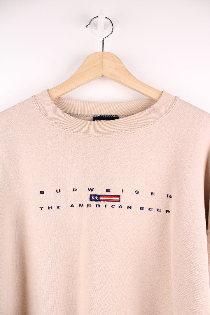 Vintage Budweiser 'The American Beer' tan crewneck sweatshirt by Jansport, features embroidered spell-out details across the front