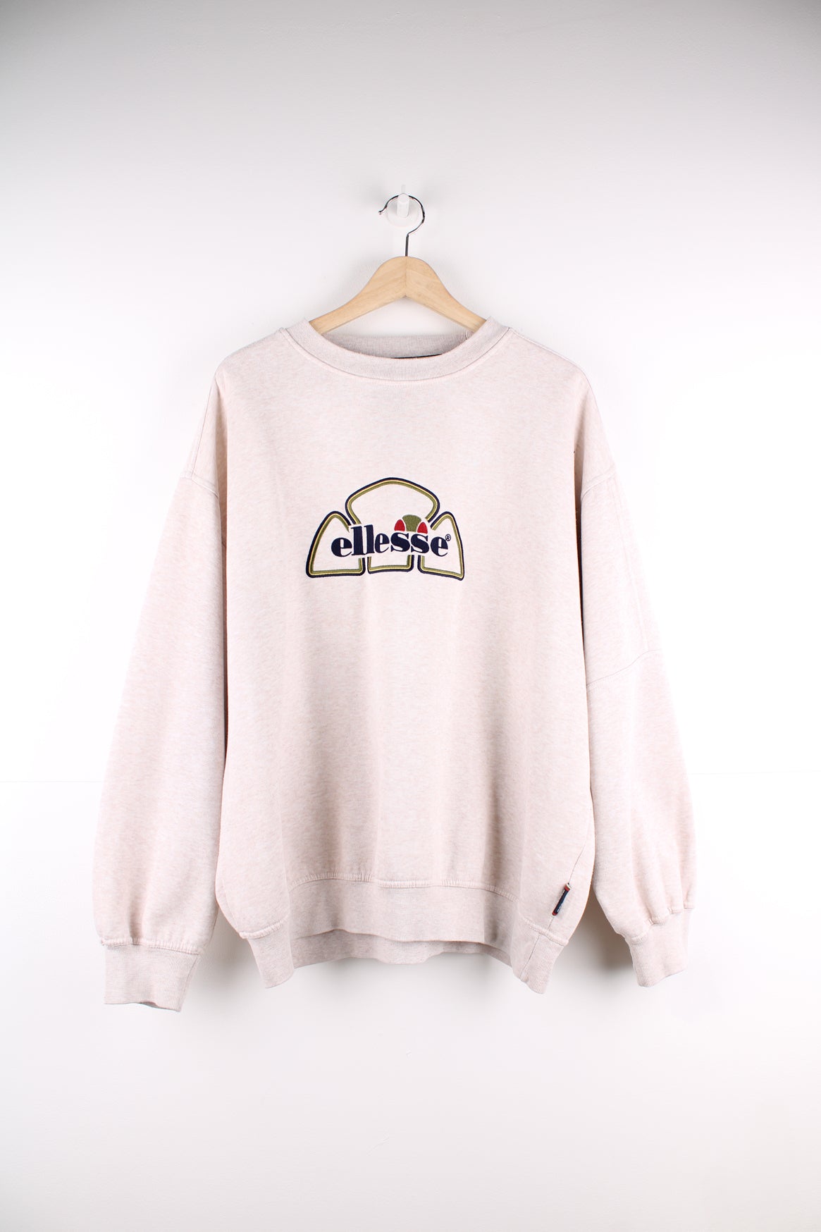 Vintage Ellesse tan crewneck sweatshirt, features embroidered spell-out logo on the chest 