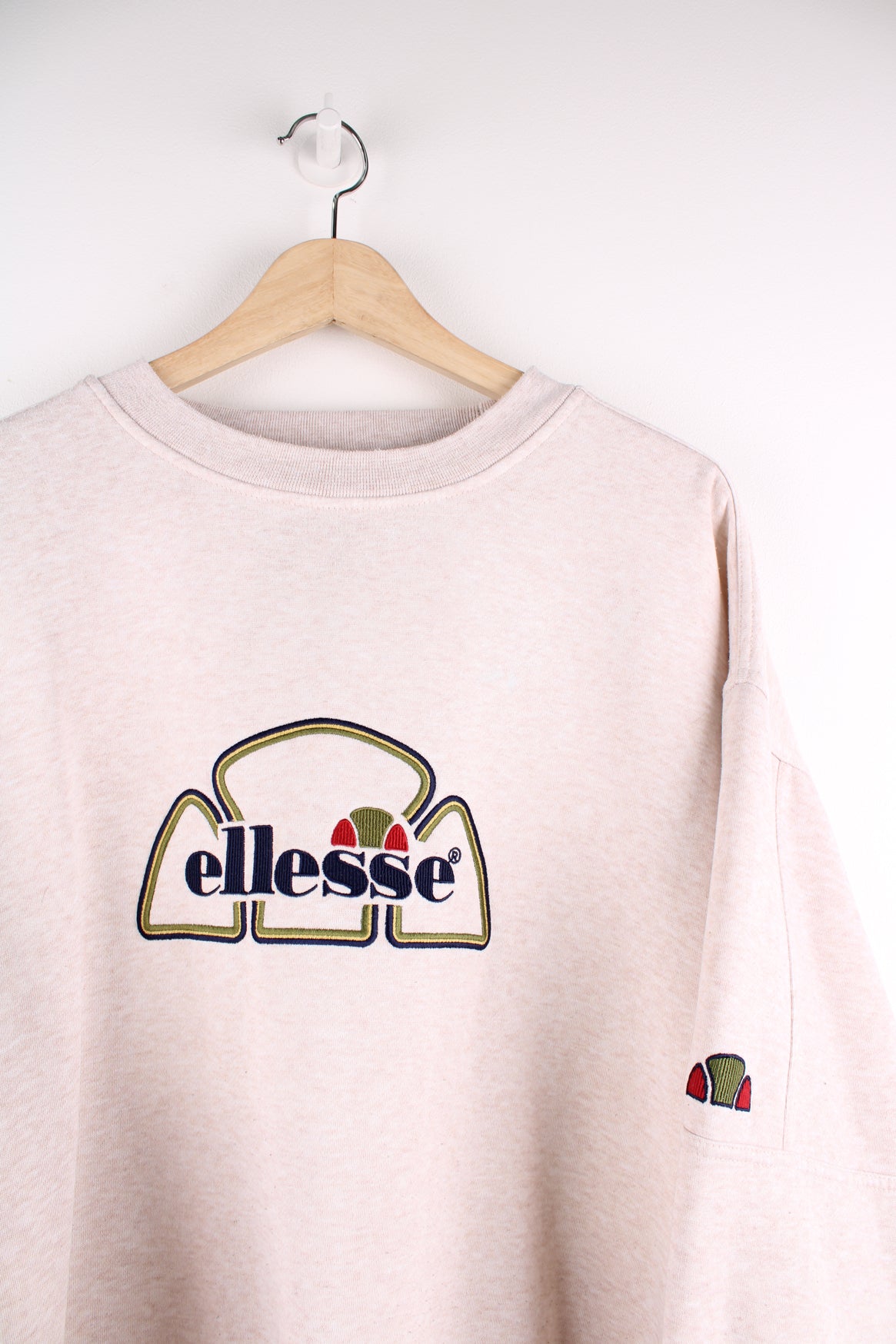 Vintage Ellesse tan crewneck sweatshirt, features embroidered spell-out logo on the chest 