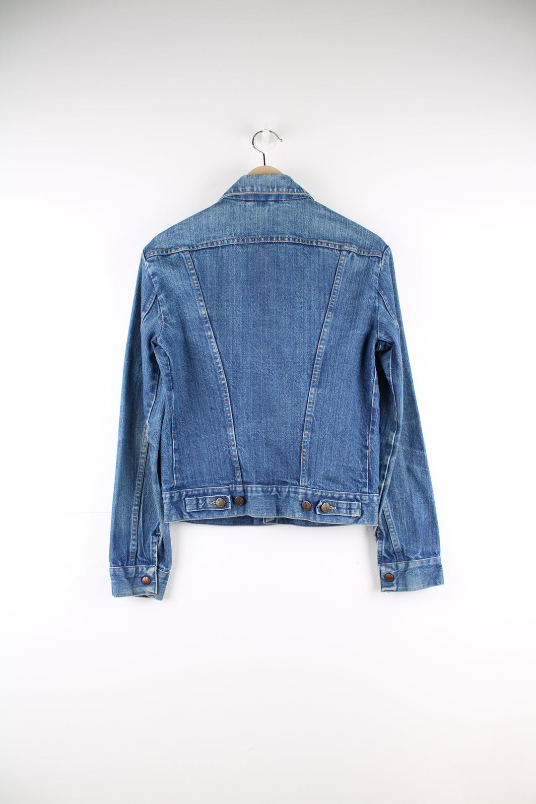 Vintage 1980's Wrangler blue denim button up trucker jacket with signature logo on the pocket 