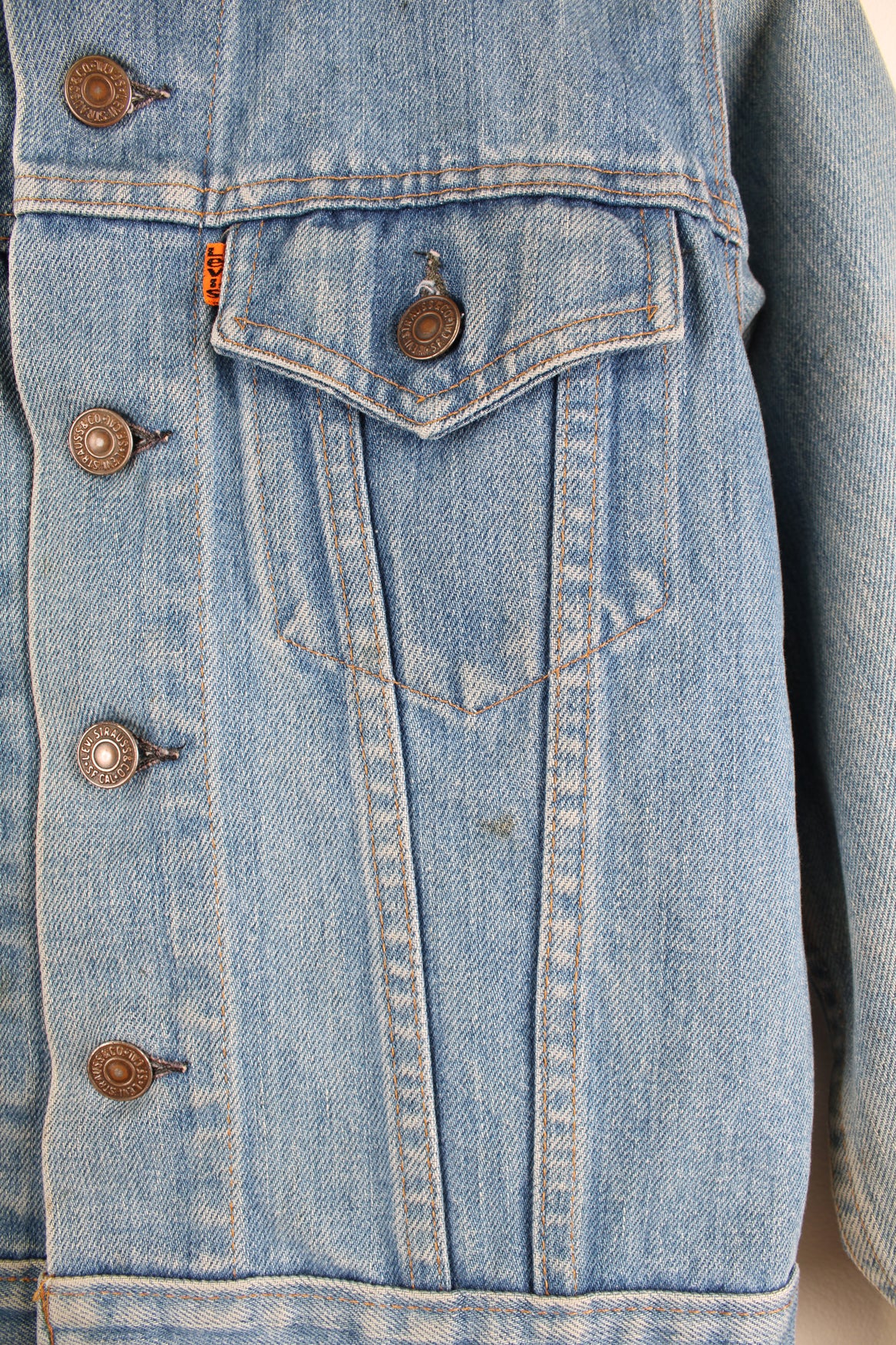 Vintage 1970s Levi Strauss orange tab light wash cropped denim trucker jacket with pockets 