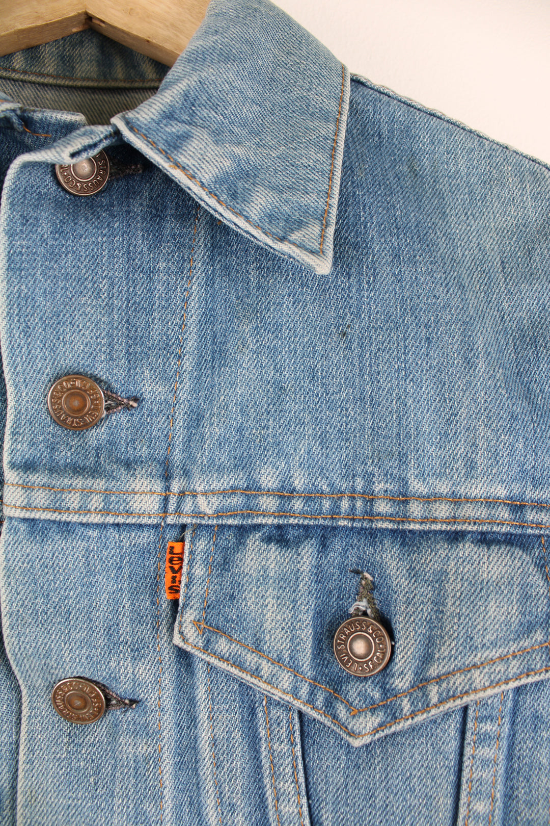 Vintage 1970s Levi Strauss orange tab light wash cropped denim trucker jacket with pockets 