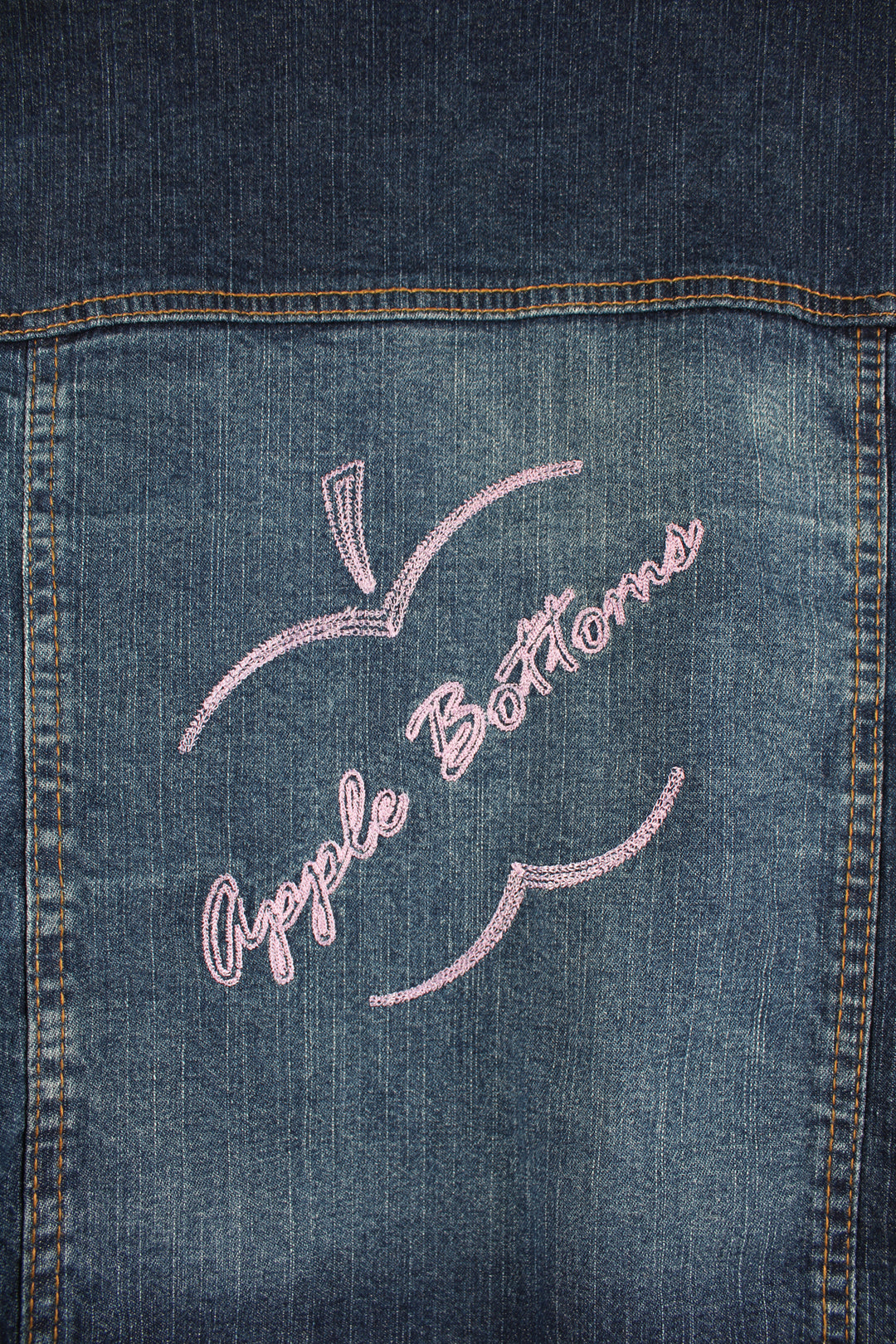 Y2K Apple Bottoms zip through denim jacket, features graffiti like embroidery on the shoulders 