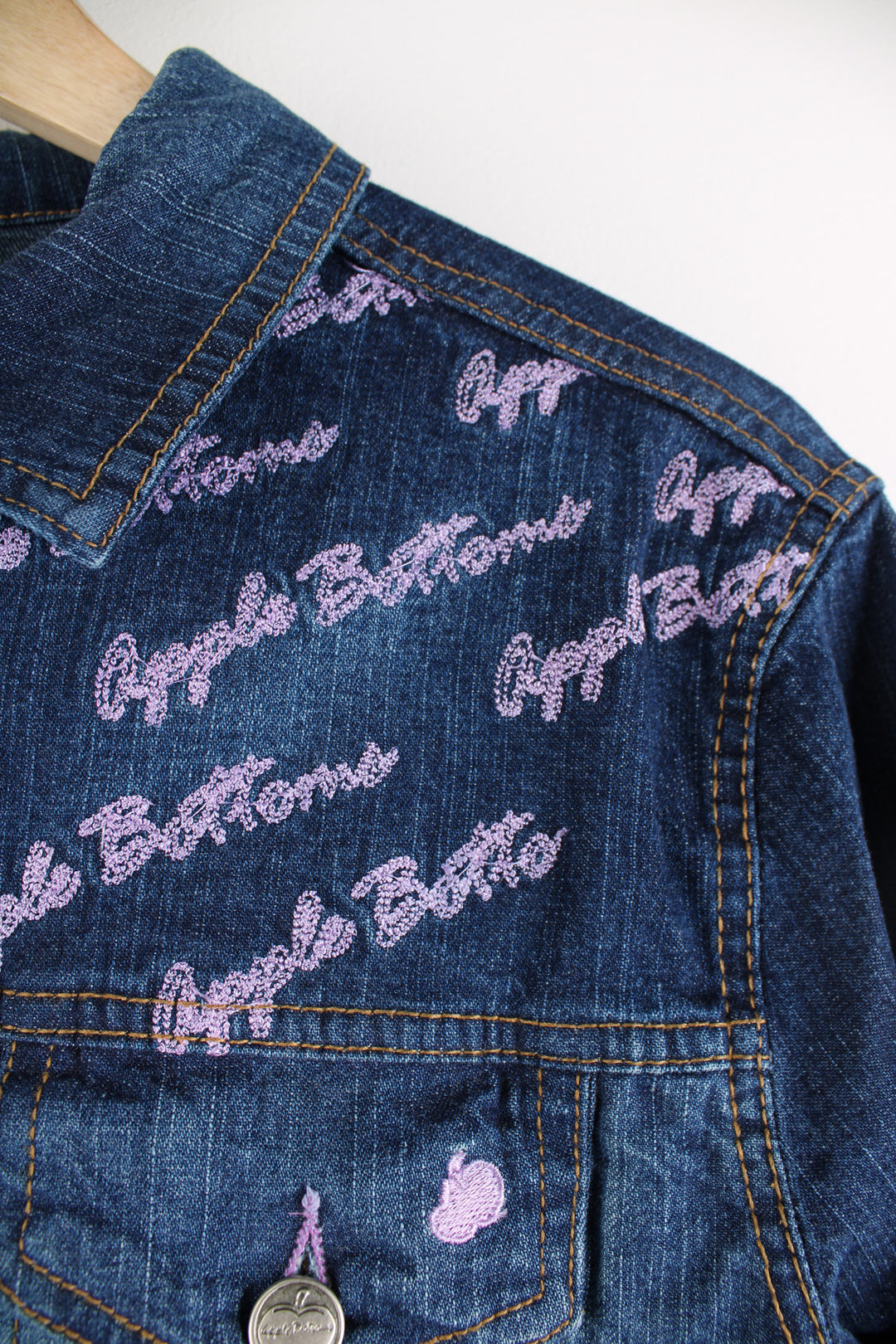 Y2K Apple Bottoms zip through denim jacket, features graffiti like embroidery on the shoulders 