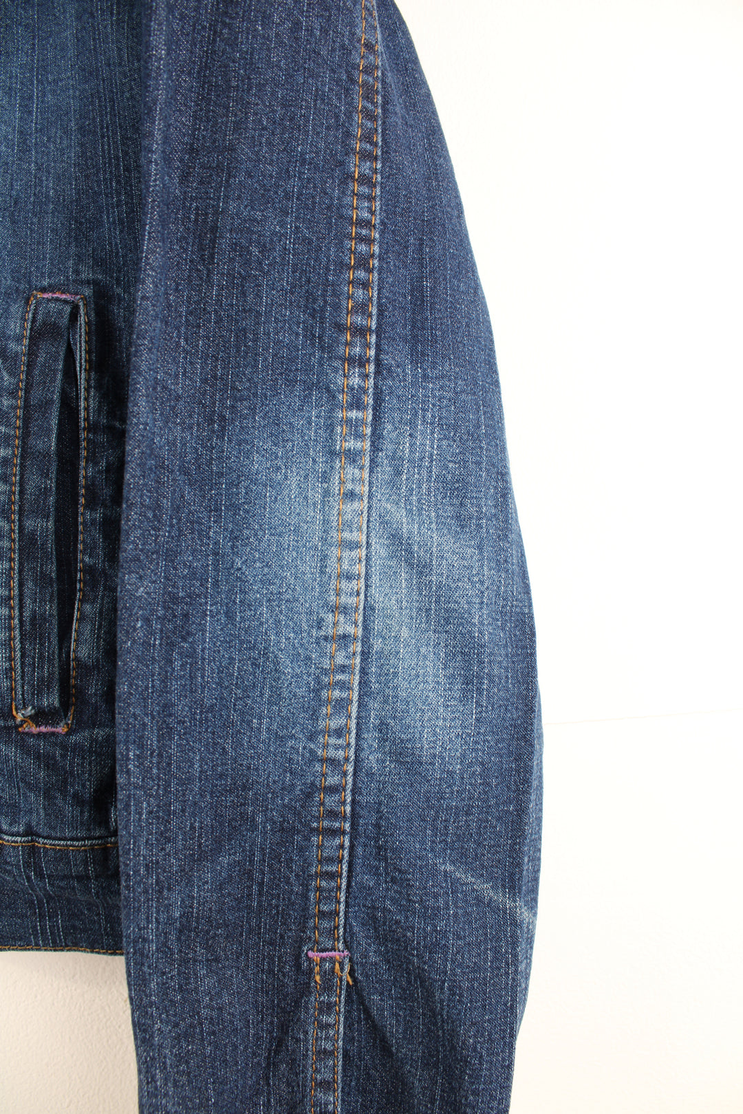 Y2K Apple Bottoms zip through denim jacket, features graffiti like embroidery on the shoulders 