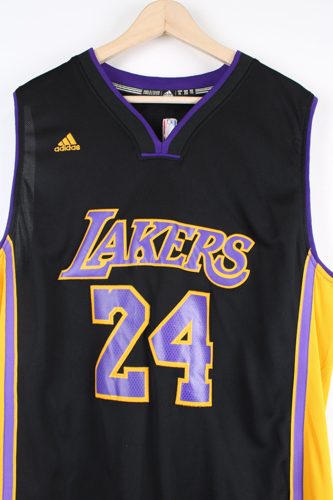 Los Angeles Lakers number 24 Kobe Bryant NBA Jersey. Made by Swingman/ Adidas and features applique letters/ numbers.  good condition  Size in Label:  Mens XL