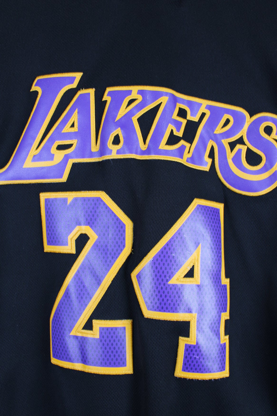 Los Angeles Lakers number 24 Kobe Bryant NBA Jersey. Made by Swingman/ Adidas and features applique letters/ numbers.  good condition  Size in Label:  Mens XL