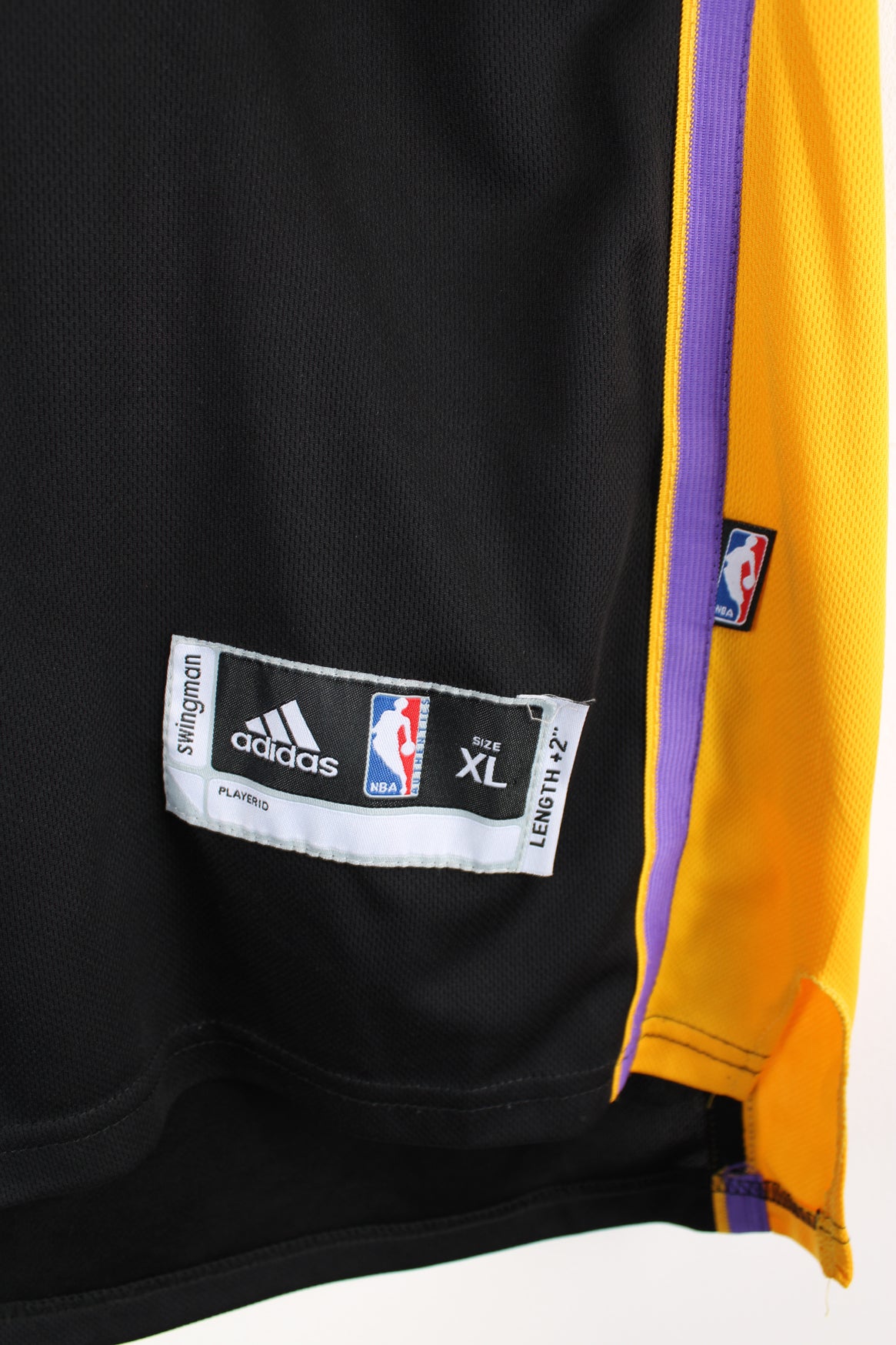 Los Angeles Lakers number 24 Kobe Bryant NBA Jersey. Made by Swingman/ Adidas and features applique letters/ numbers.  good condition  Size in Label:  Mens XL