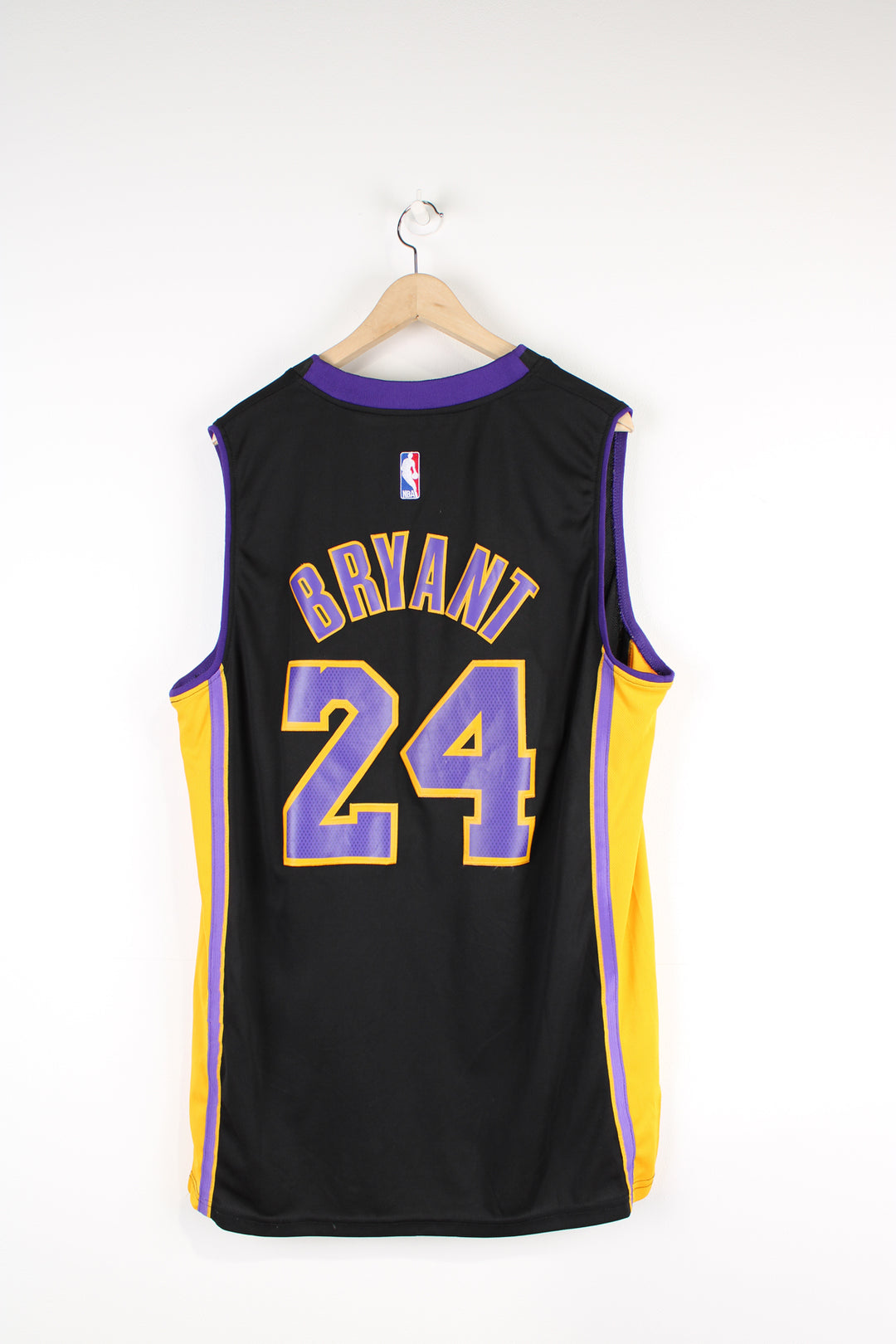 Los Angeles Lakers number 24 Kobe Bryant NBA Jersey. Made by Swingman/ Adidas and features applique letters/ numbers.  good condition  Size in Label:  Mens XL