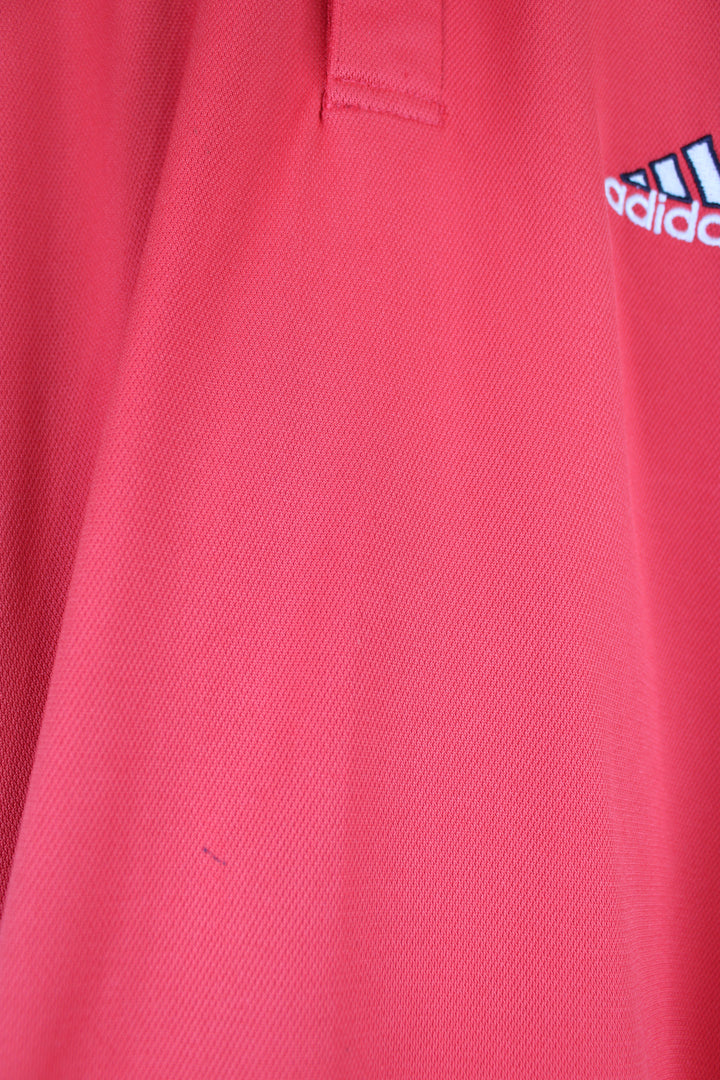 Vintage Adidas Polo Shirt in a red and navy colourway, has the iconic 3 white stripes going down the sleeves, button up with embroidered logo on the chest. 