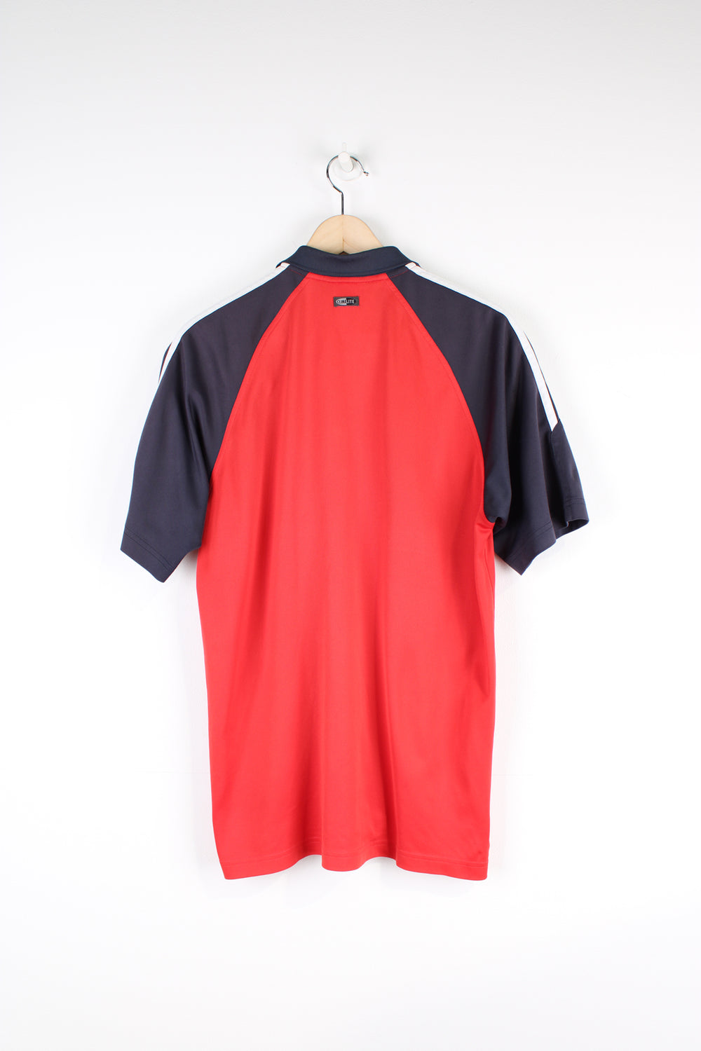 Vintage Adidas Polo Shirt in a red and navy colourway, has the iconic 3 white stripes going down the sleeves, button up with embroidered logo on the chest. 