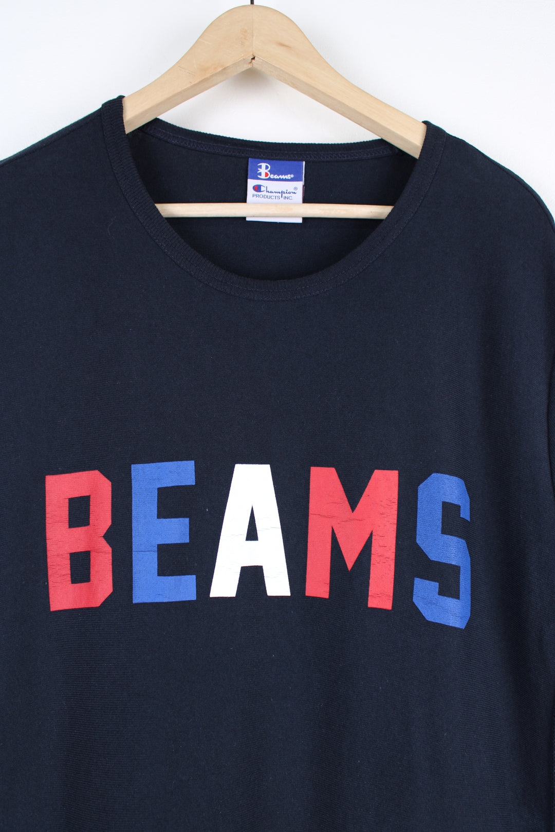 Beams x Champion T-shirt, blue, red and white colourway, short sleeves, big neck lining, has a big front pocket, as well as big spell-out logo across the chest. 