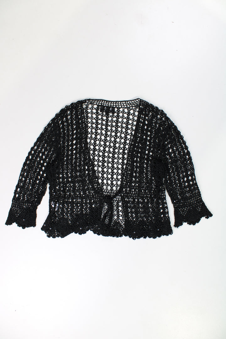 Crochet knit top/ cardigan in black with black glittery thread throughout.