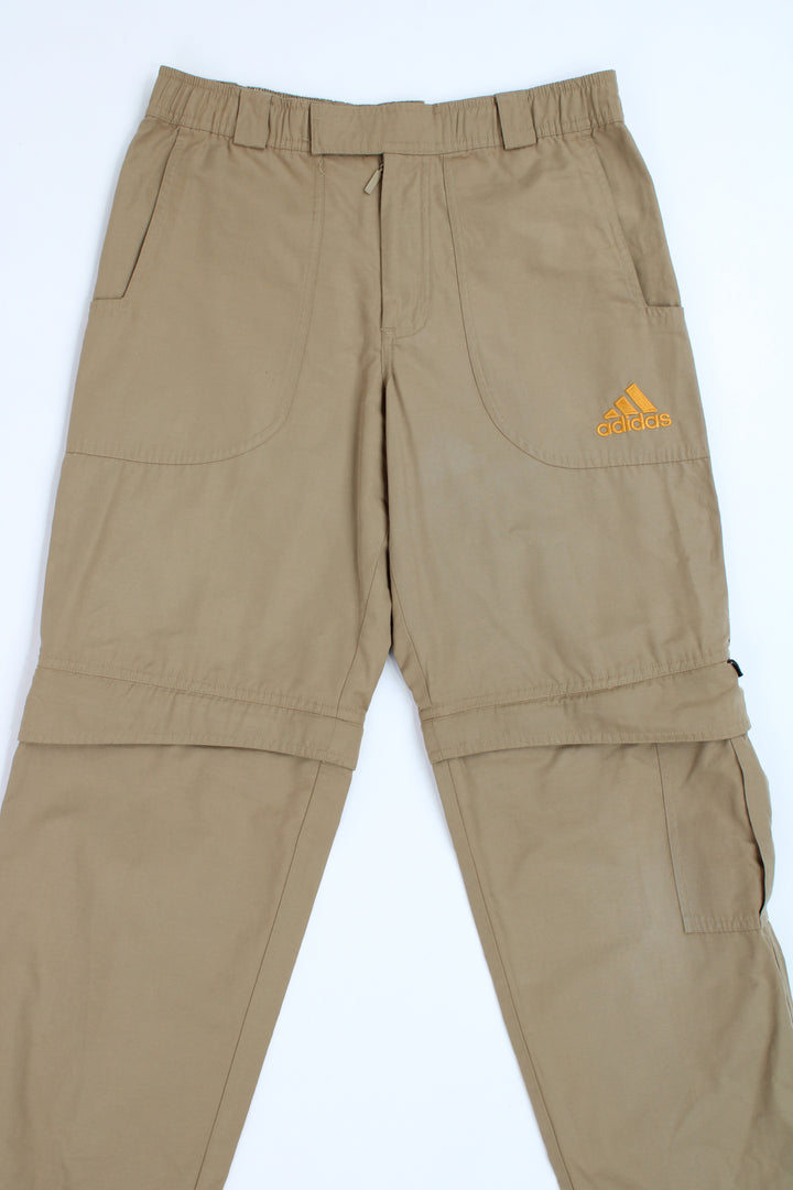 Adidas tan sport trousers with zip off legs and embroidered logo on the pocket