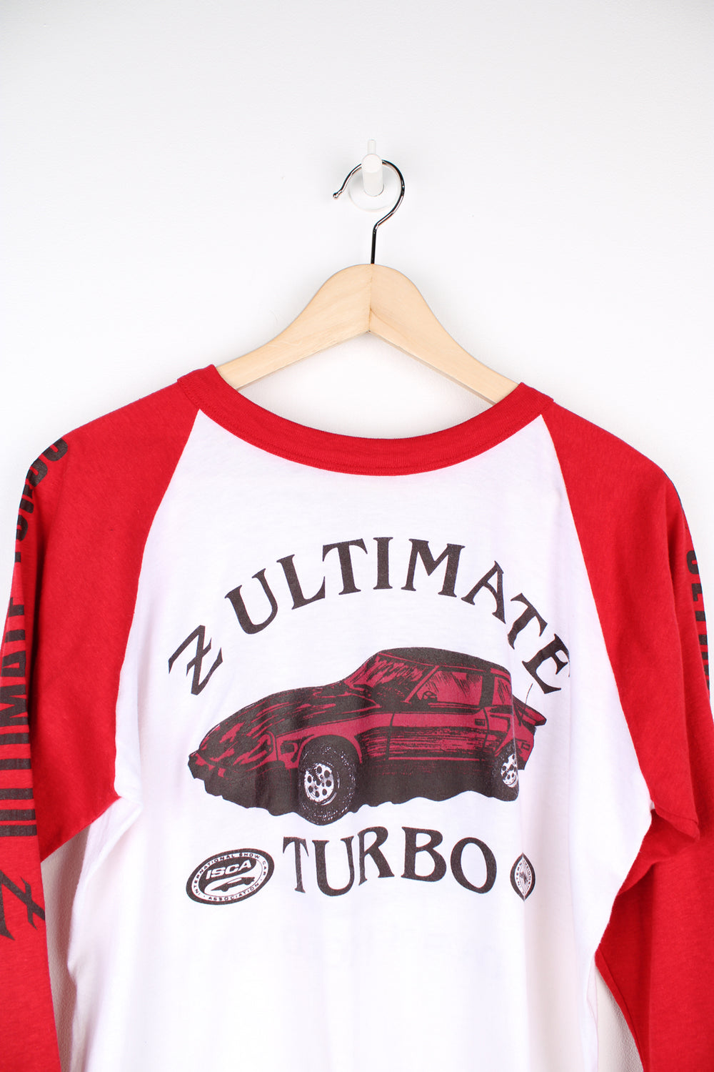 Vintage early 80's white and red, single stitch baseball style tee with blue " Z ultimate turbo" graphic on the front and "Winston Championship Auto Show" on the back by Cal Cru 