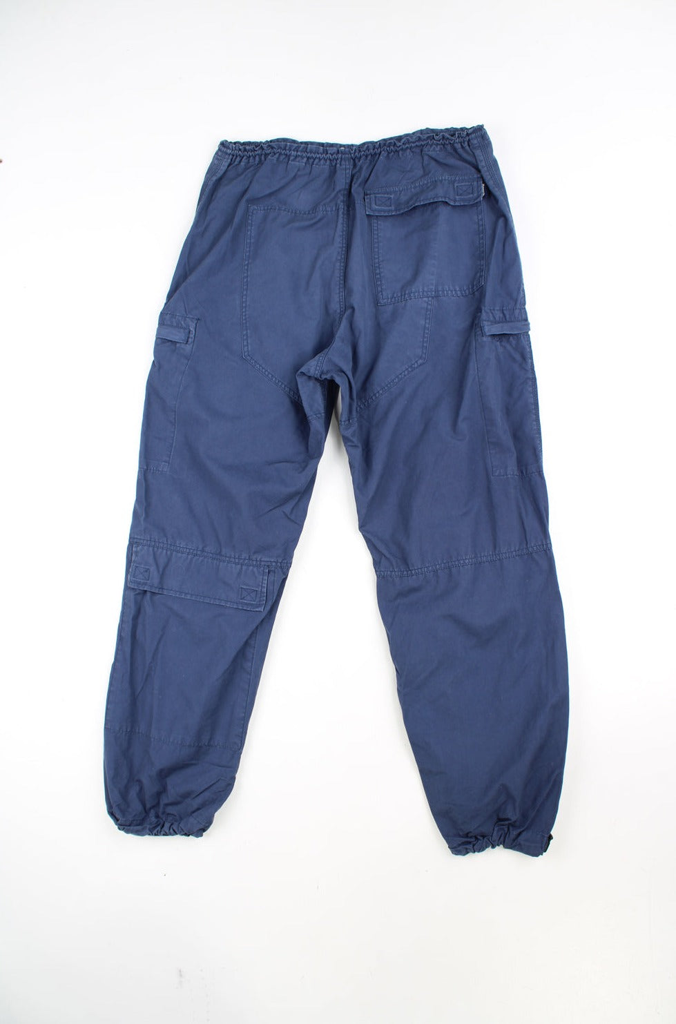 Y2K navy blue cargo trousers by Bench, features multiple pockets and adjustable waistband and cuffs 