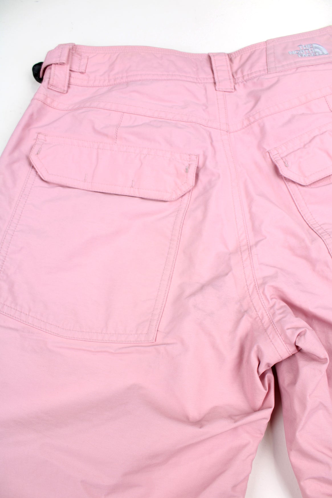 The North Face Hyvent baby pink fleece lined salopettes, features zip up pockets and embroidered logo on the leg