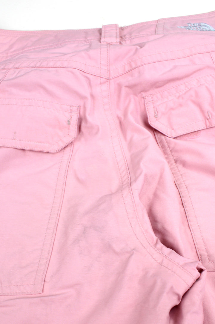 The North Face Hyvent baby pink fleece lined salopettes, features zip up pockets and embroidered logo on the leg