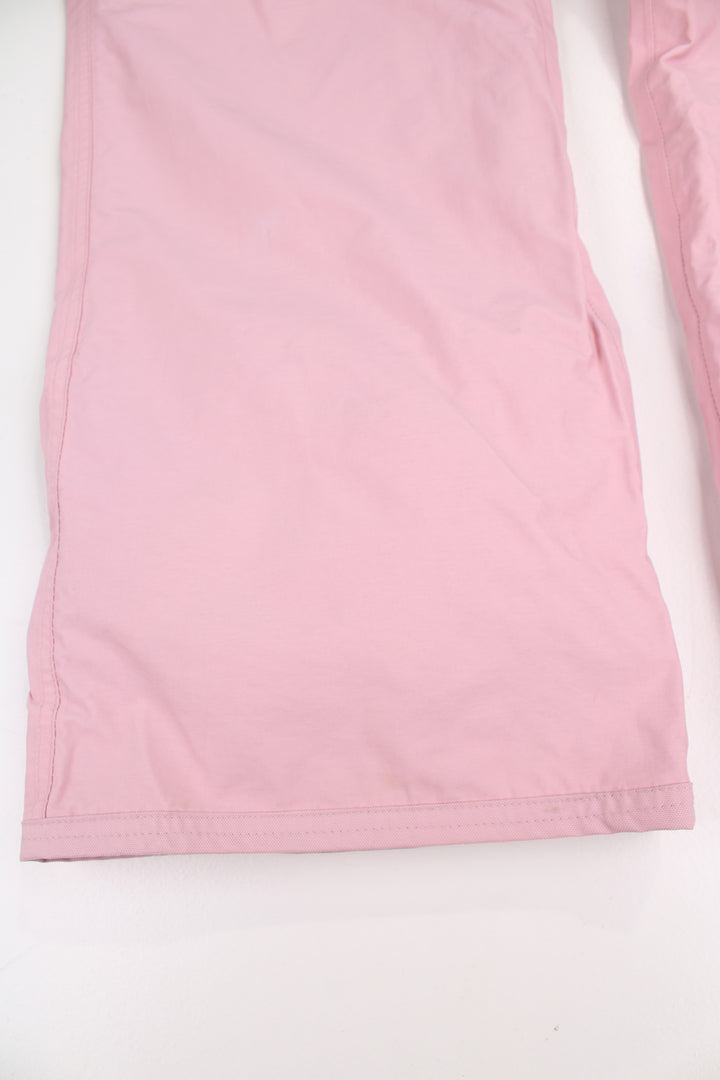 The North Face Hyvent baby pink fleece lined salopettes, features zip up pockets and embroidered logo on the leg