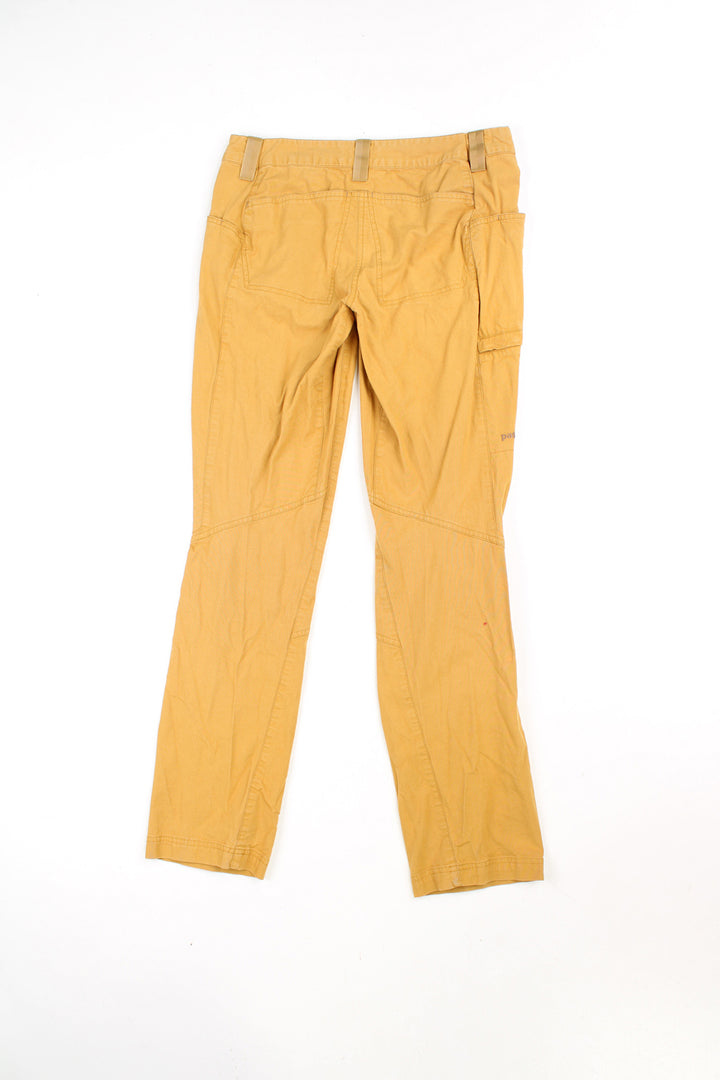 Patagonia women's mustard yellow cotton lightweight walking trousers, features embroidered logo on the let 