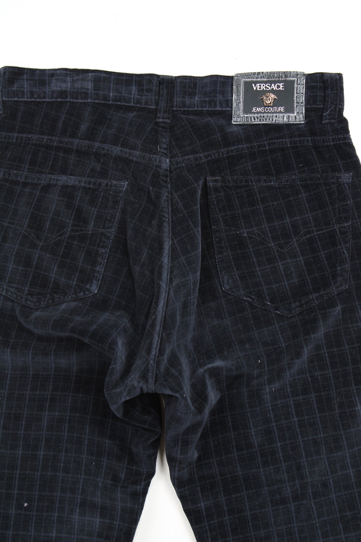 Vintage Versace dark blue tartan high-waisted trousers in velvet, features branded hardware 