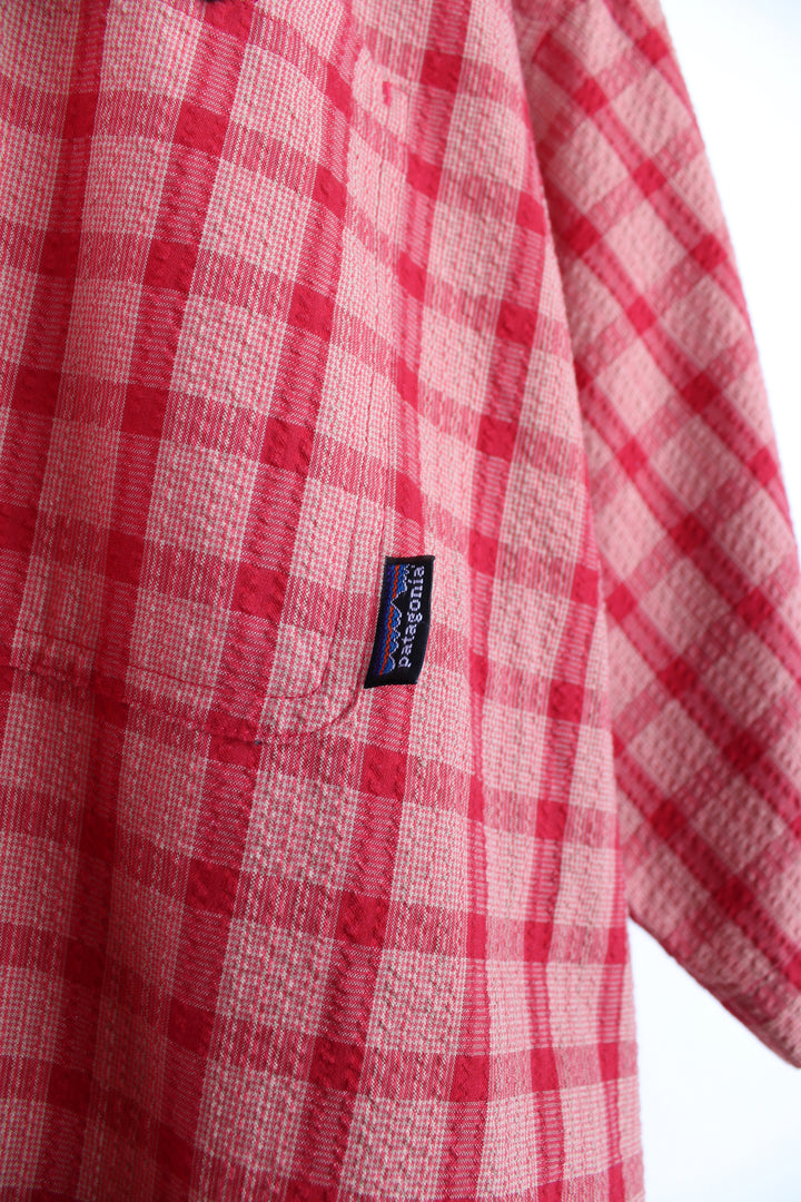 Patagonia rusted red large plaid shirt with signature Patagonia label on the pocket