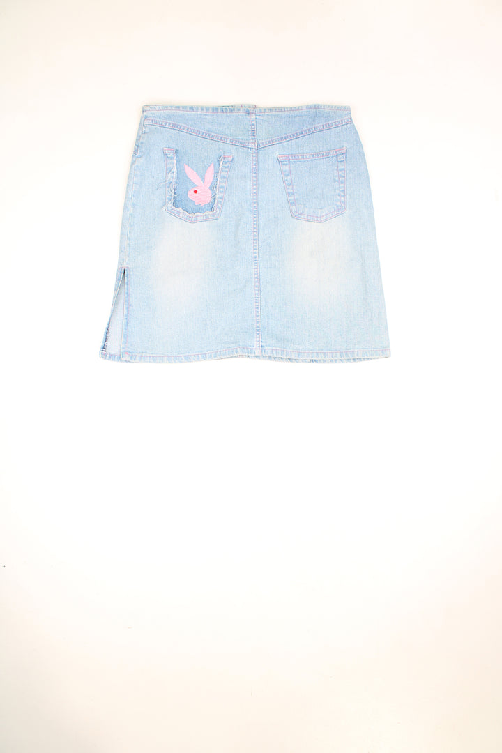 Vintage Y2K light denim mini skirt with pink contrast stitching and embroidered Playboy logo onthe back pocket. Could be worn mid or low rise depending on measurements.  good condition  Size in label:   Womens 12 