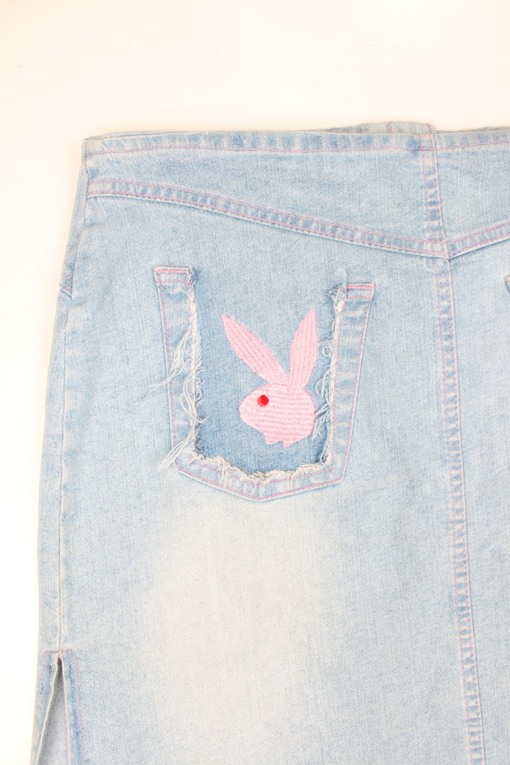 Vintage Y2K light denim mini skirt with pink contrast stitching and embroidered Playboy logo onthe back pocket. Could be worn mid or low rise depending on measurements.  good condition  Size in label:   Womens 12 