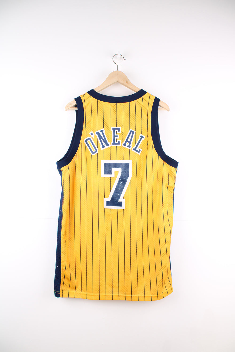 Jermaine O'Neal #7 for the Indiana Pacers NBA jersey in yellow by Nike, features embroidered spell-out on the front and back