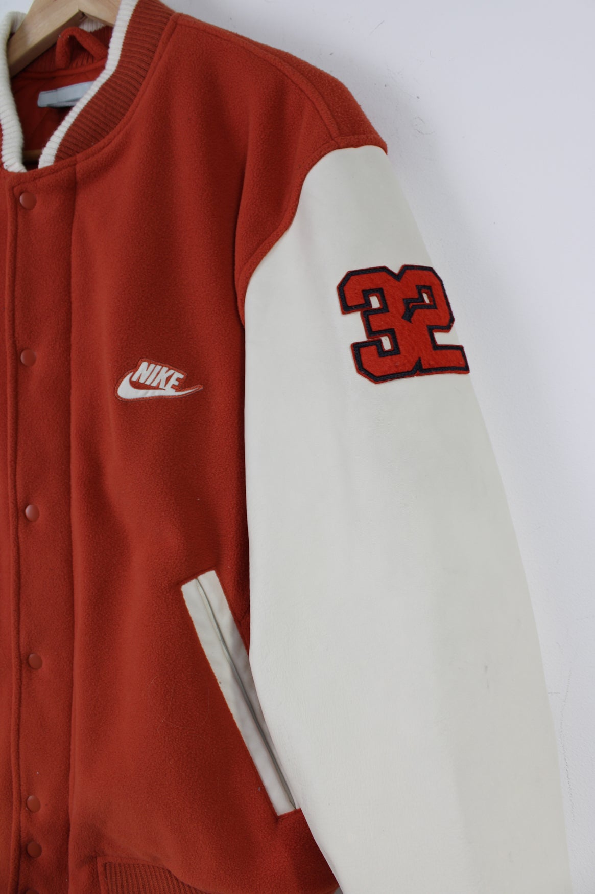 Vintage Nike Oregon orange and white fleece varsity jacket with leather sleeves and embroidered spell-out details