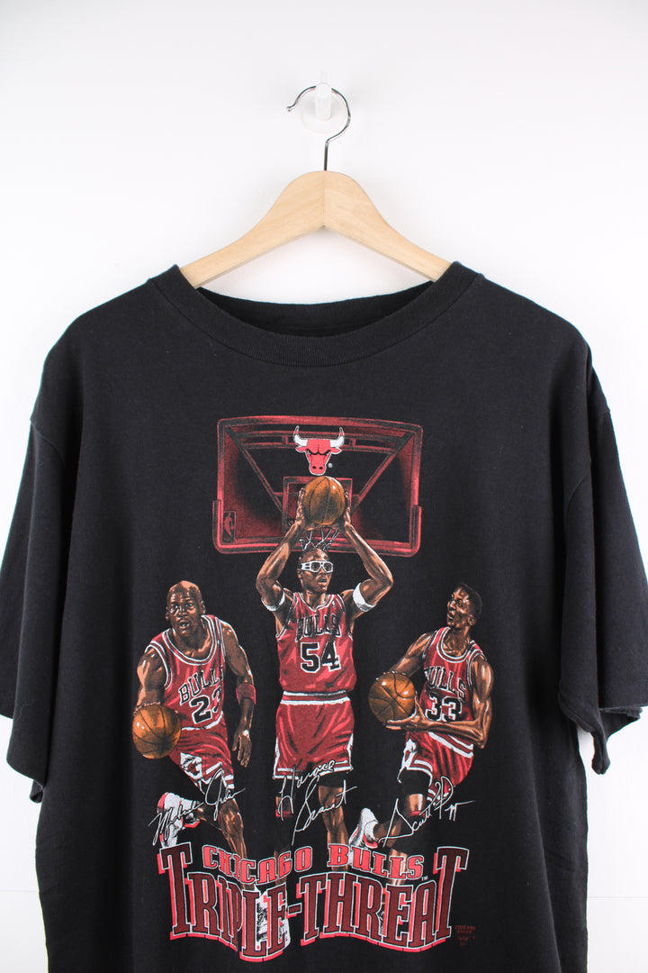 Vintage 90's 'Chicago Bulls Triple Threat' single stitch t-shirt features Michael Jordan, Scottie Pippen and Horace Grant printed graphic on the front 