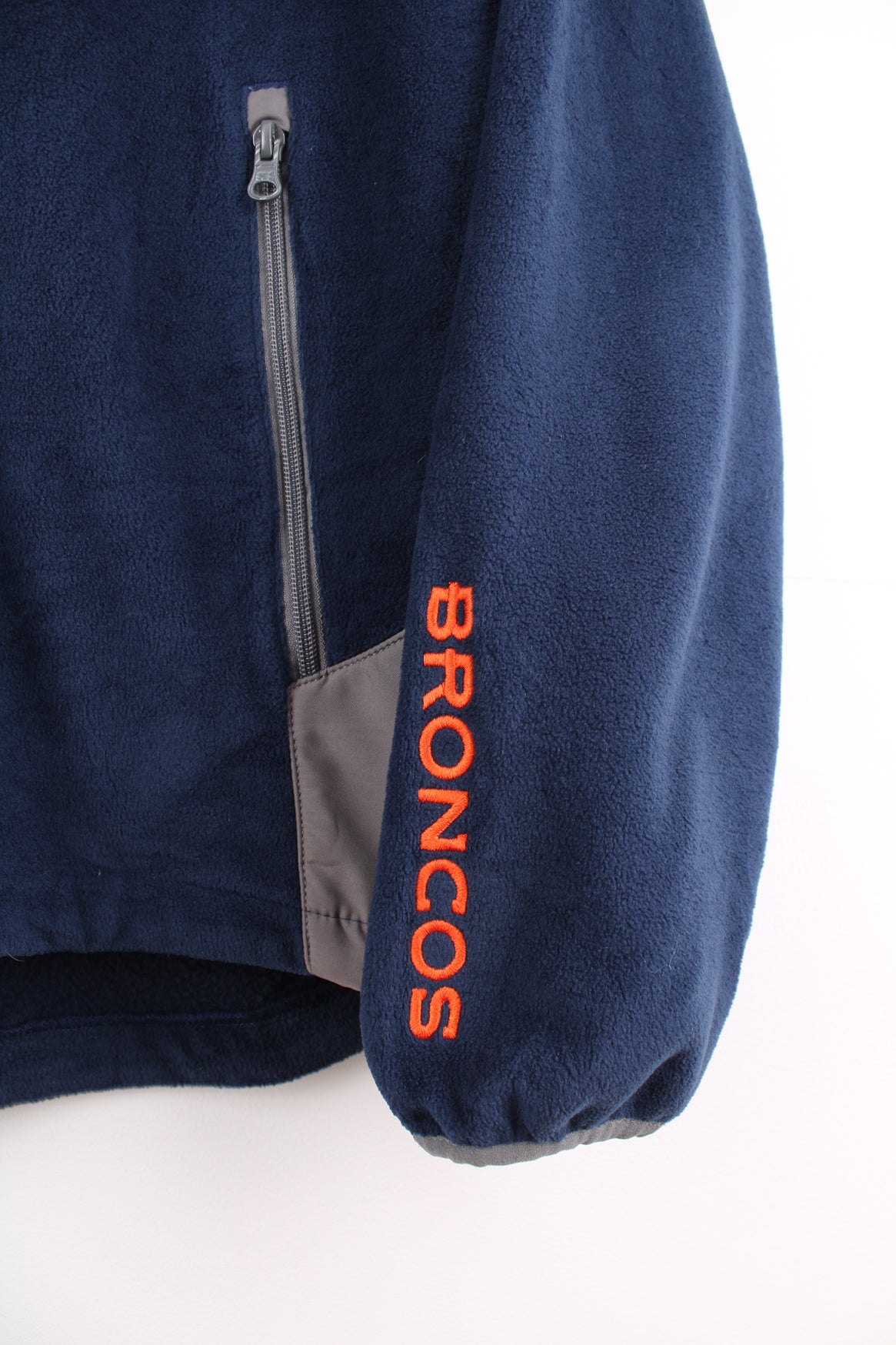 Denver Broncos navy blue and grey zip through fleece features embroidered logo on the chest and zip up pockets 