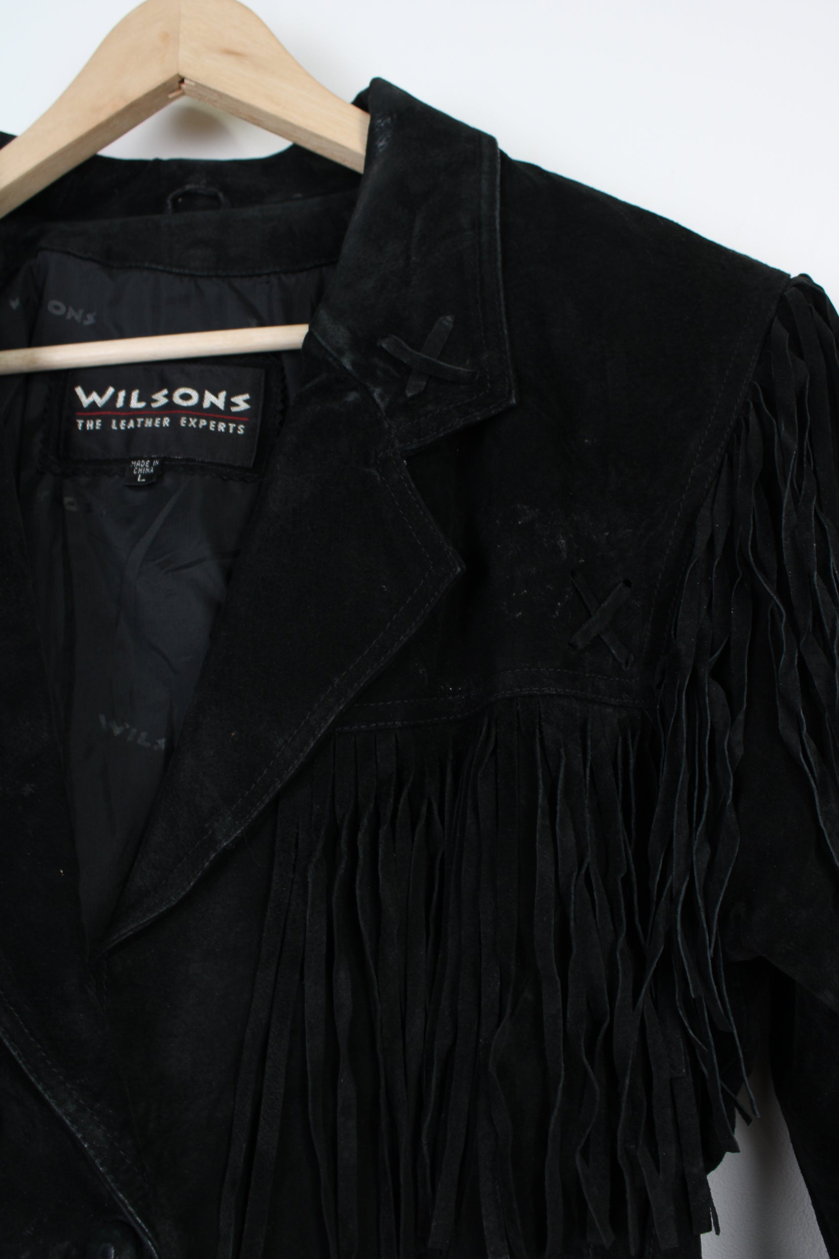 Vintage black cropped suede fringe jacket features three popper buttons at the front