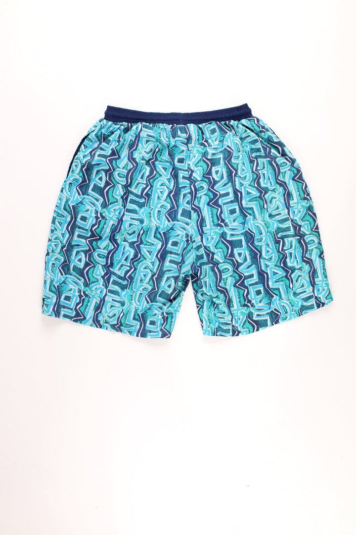 Vintage 90's Reebok blue graffiti print swim shorts with embroidered logo on the leg and elasticated/ drawstring waistband.   good condition - missing its inner net lining  Size in Label:  XL