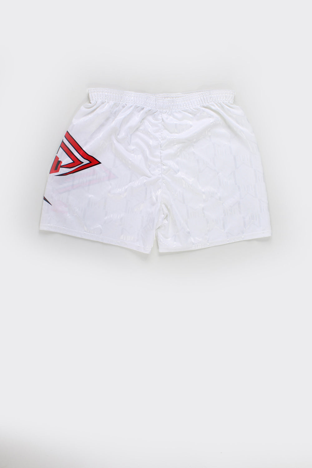 Vintage Made in England 1992-94 Manchester United home football shorts by Umbro, all white featuring raised badge on the leg and red Umbro graphic/logo on the other.