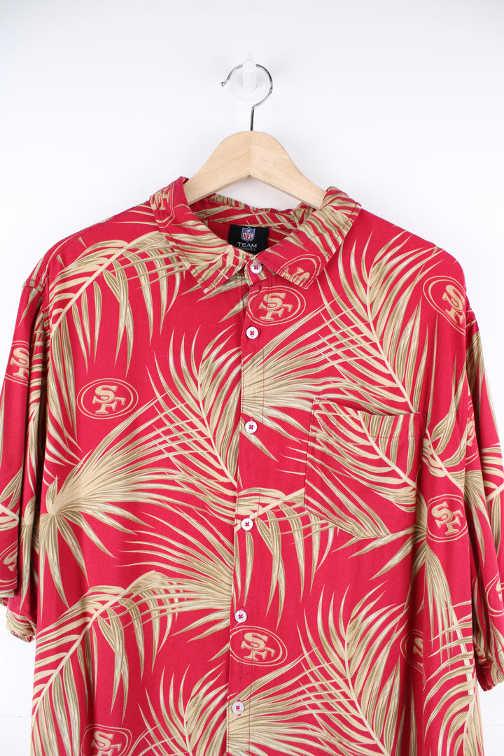 San Francisco 49ers Hawaiian Shirt in a red and gold colourway, floral design with the team logo printed all over, button up and has a chest pocket.