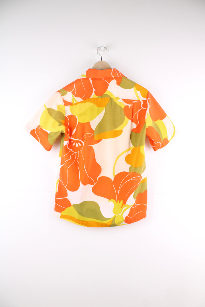 Vintage 60's Hawaiian Shirt in a orange, white and yellow colourway, floral pattern design printed all over, button up with a camp collar and has a chest pocket.