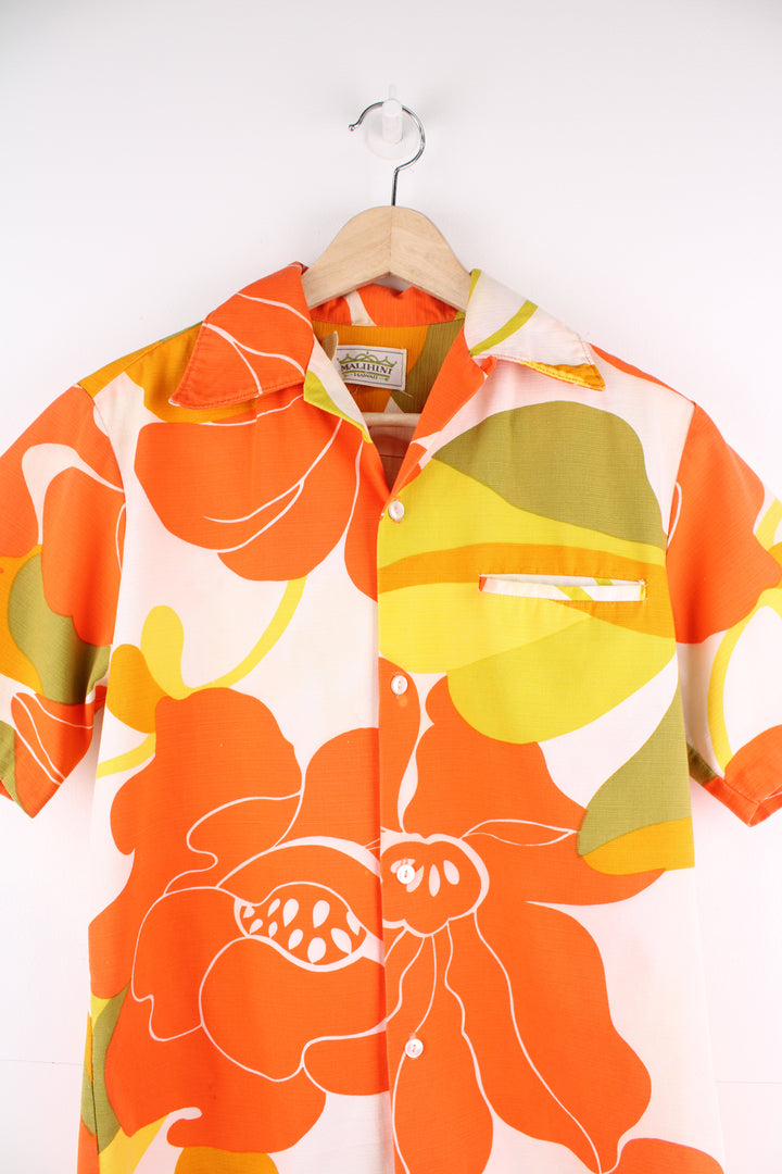 Vintage 60's Hawaiian Shirt in a orange, white and yellow colourway, floral pattern design printed all over, button up with a camp collar and has a chest pocket.