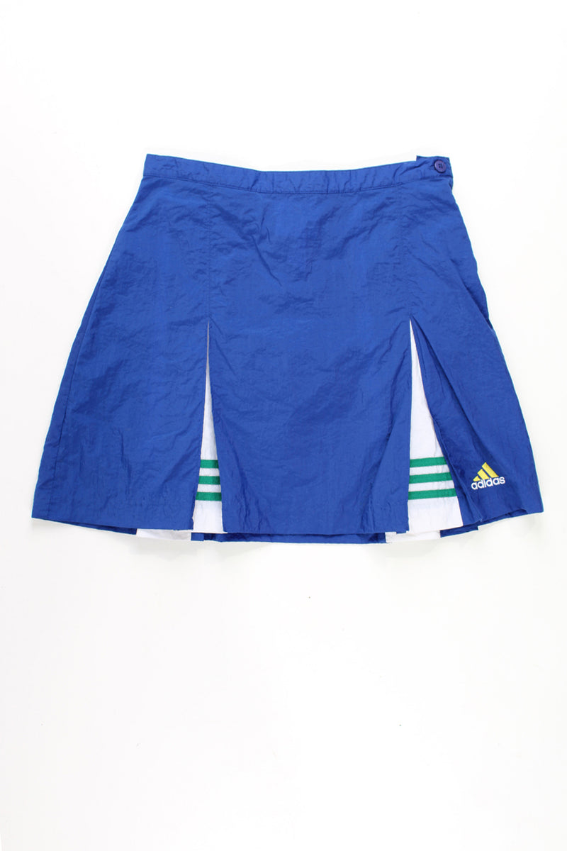 Vintage 90's royal blue nylon Adidas sporting skirt with embroidered logo and zip fastening. Features embroidered logo on the hem 