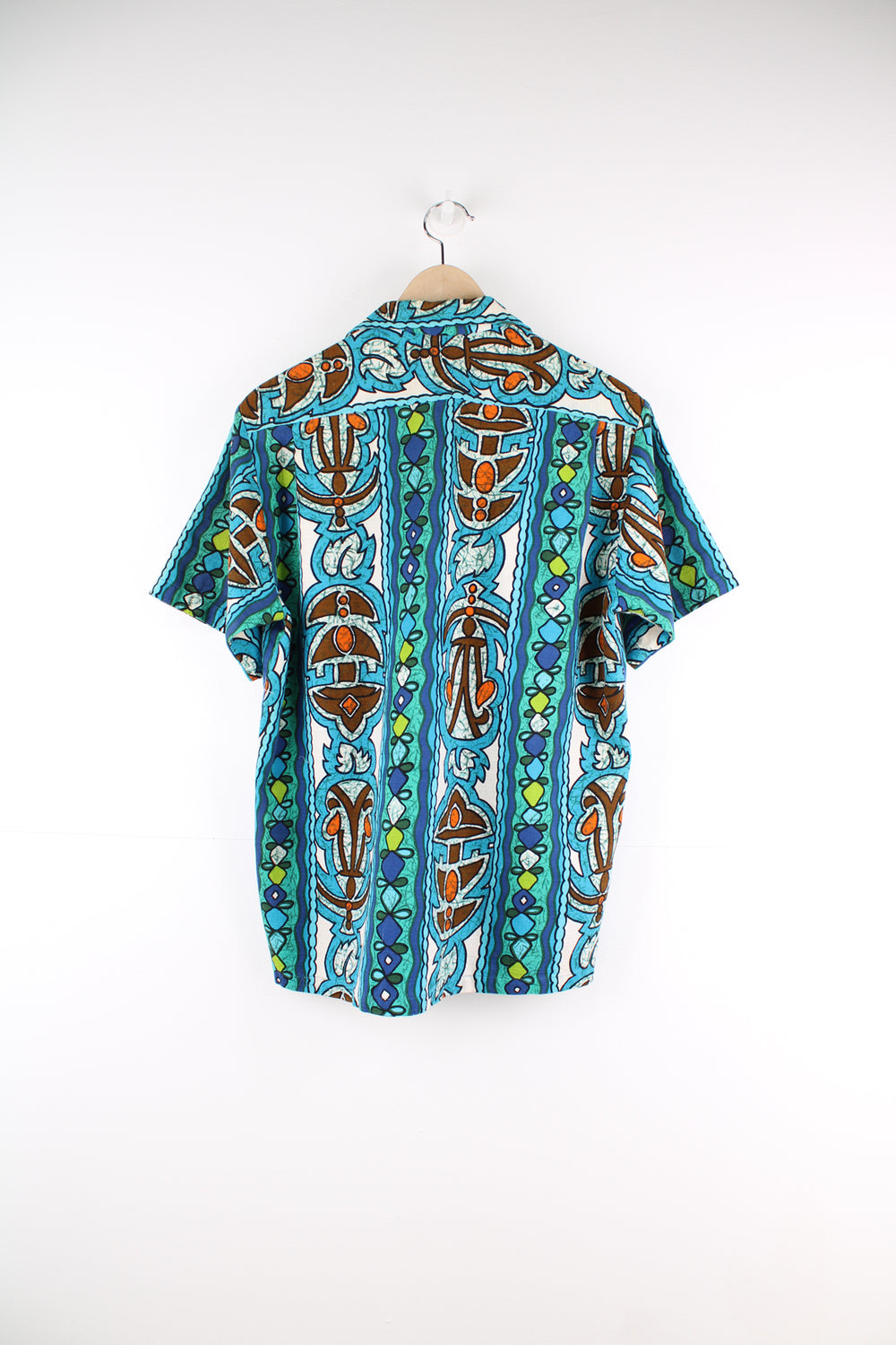 Vintage 60's Hawaiian Shirt in a blue colourway, tribal style print all over, button up with a camp collar and has a chest pocket.