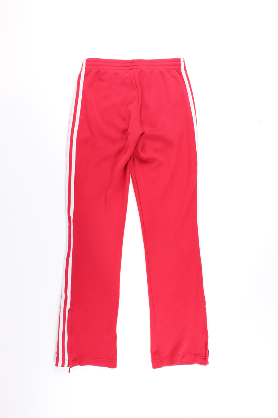 Adidas Tracksuit Bottoms in a red colourway with the iconic 3 white stripes going down the legs, has a elasticated waist, pintucked, pockets, and logo embroidered on the front.