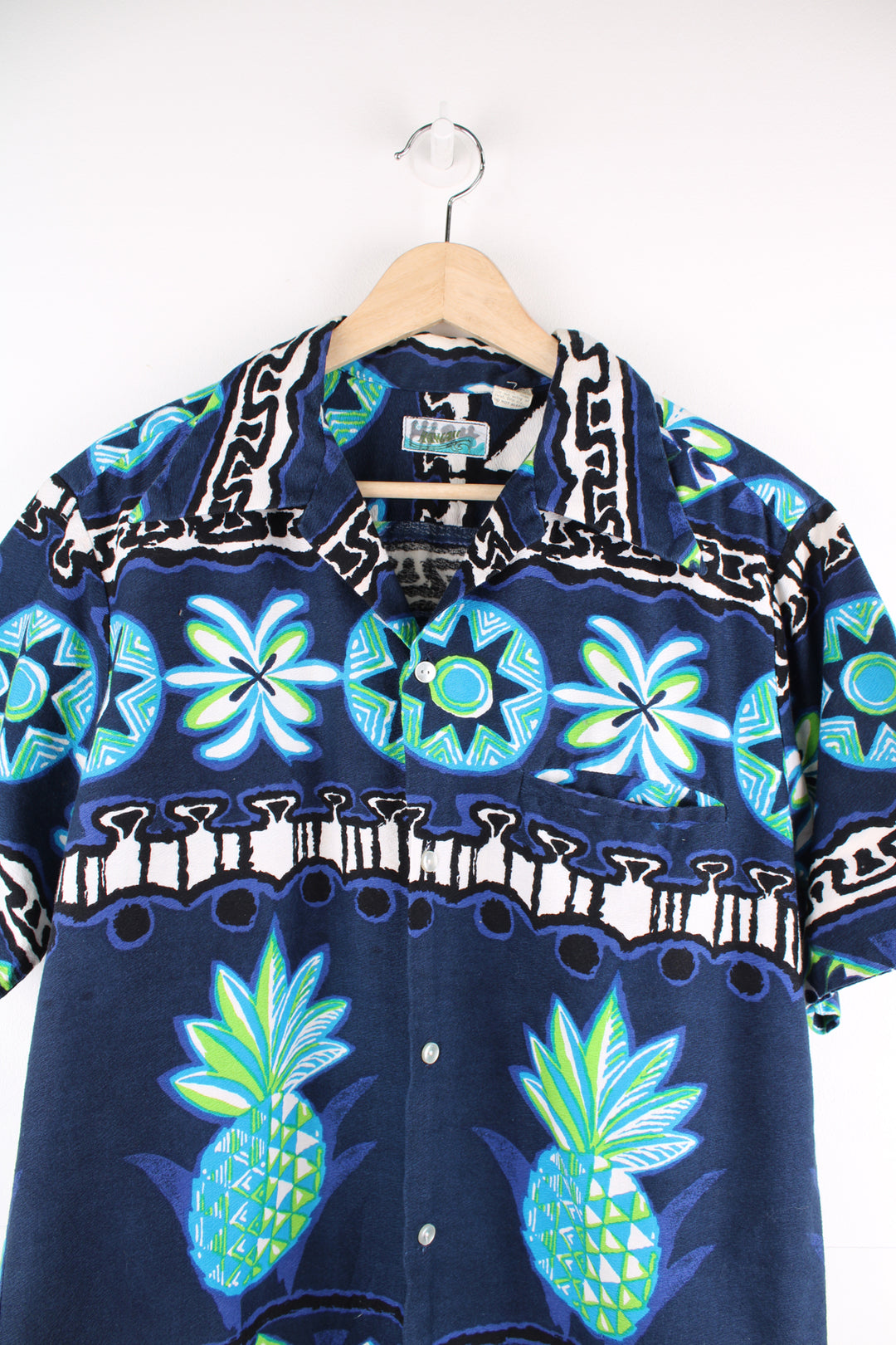 Vintage 70's Penny's Hawaiian Shirt in a blue colourway, tribal style print all over, button up with a camp collar and has a chest pocket.