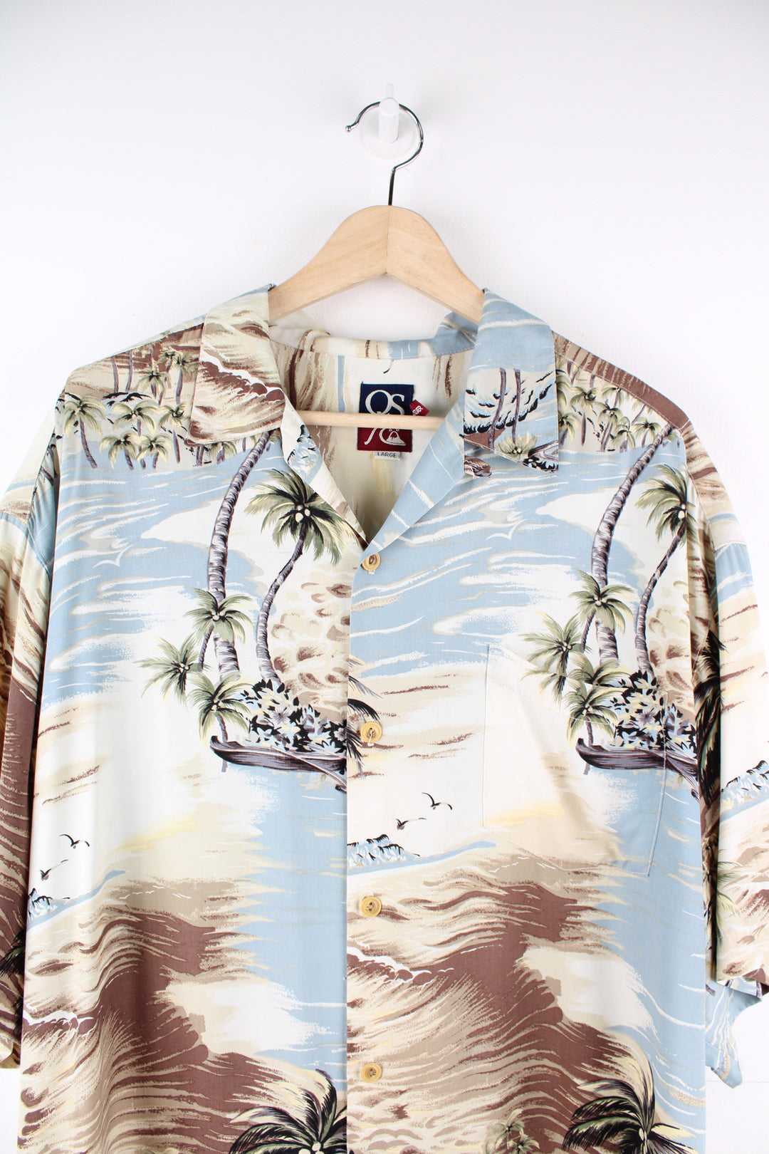 Quiksilver Hawaiian Shirt in a blue and tanned colourway, island style print all over, button up with camp collar and has a chest pocket.