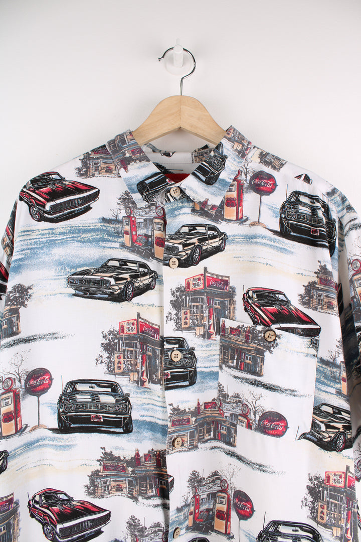 Coca Cola Hawaiian Shirt in a white colourway with cars and petrol station design printed all over, button up and has a chest pocket.