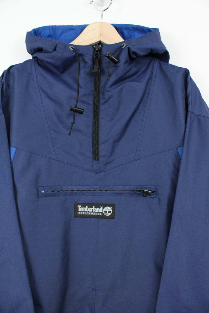 Timberland blue 1/4 zip lightweight windbreaker jacket with hood and embroidered logo on the front