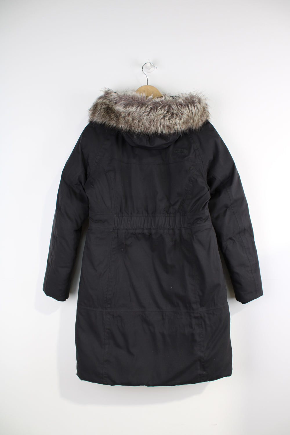 The North Face Parka Jacket in a black colourway, insulated with a quilted lining, zip up, multiple pockets, hooded with detachable fur option, and has logo embroidered on the front. 