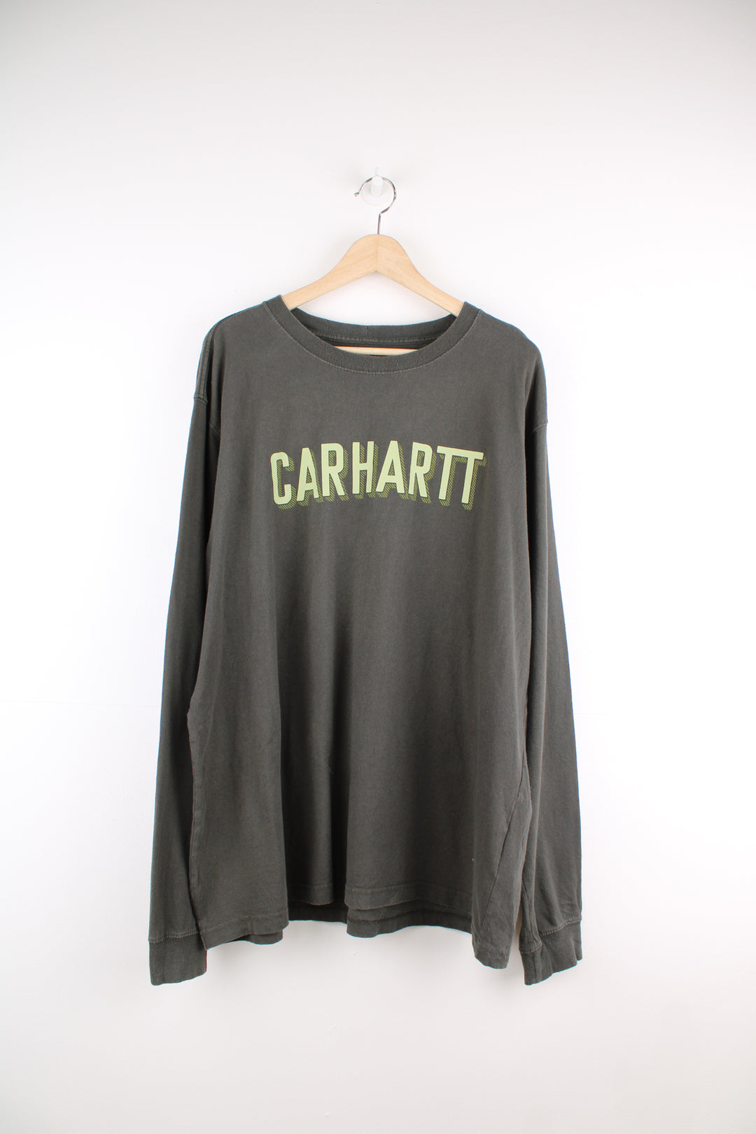 Carhartt khaki green relaxed fit long sleeve top with spell-out logo across the chest